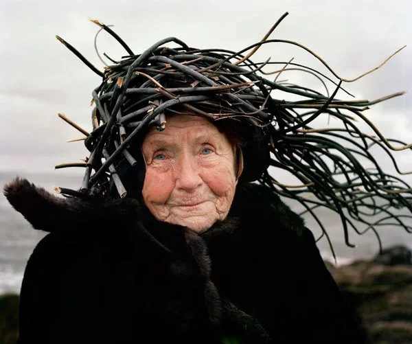 An elderly woman with a crown made of twigs An elderly woman with a crown made of twigs
